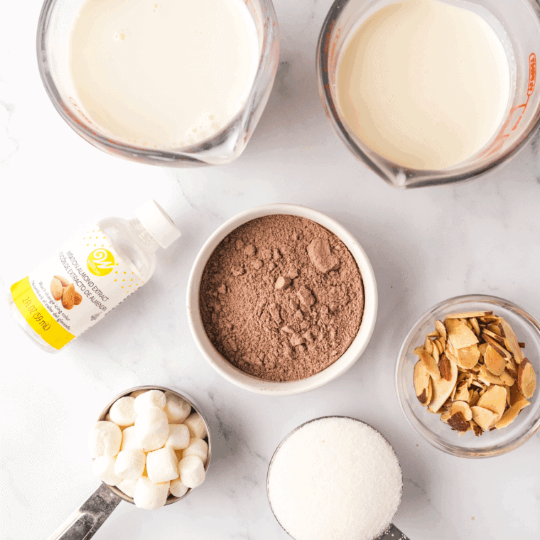 Ingredients needed for Ninja Creami Copycat Baskin Robbins Rocky Road Ice Cream Recipe on kitchen table.