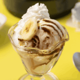 Homemade Ninja Creami Pralines n’ Cream ice cream with praline pieces and caramel swirls in a bowl.