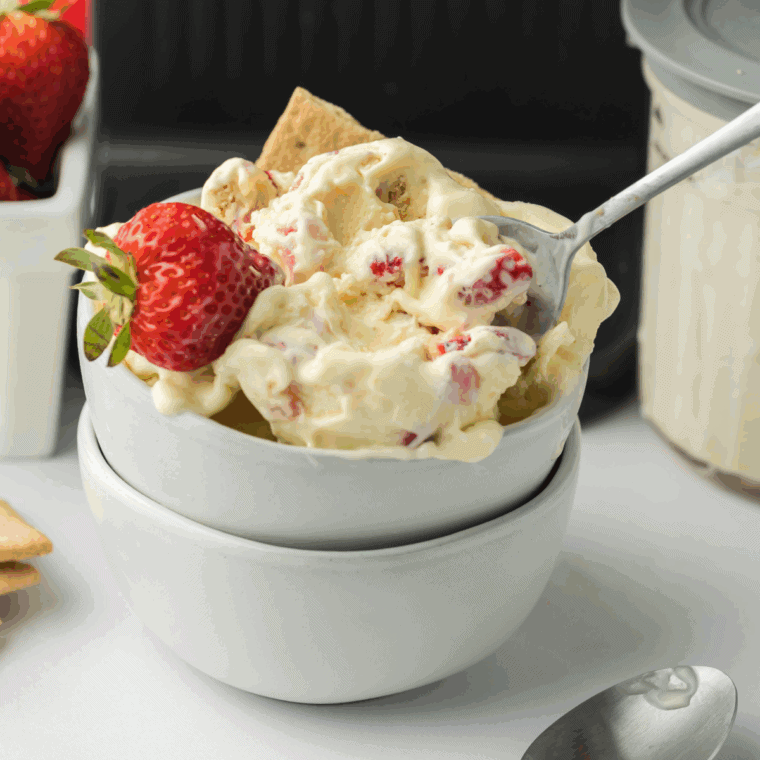 Ninja Creami Copycat Baskin Robbins Baseball Nut Ice Cream with raspberry swirl and roasted cashews in a bowl.