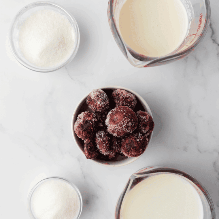 Ingredients needed for Ninja Creami Copycat Baskin Robbins Cherry Jubilee on kitchen table.