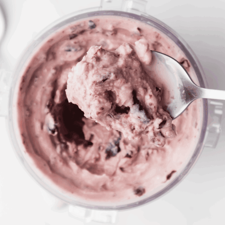 Homemade Ninja Creami Copycat Baskin Robbins Cherry Jubilee ice cream with sweet cherries in a bowl.