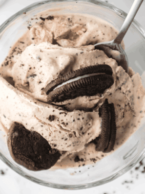 Homemade Ninja Creami Oreo Fudge Brownie Blizzard in a glass cup, topped with crushed Oreos and brownie chunks, ready to enjoy.