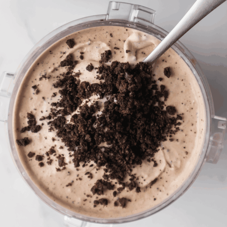 Ninja Creami Copycat Dairy Queen Oreo Fudge Brownie Blizzard in a bowl, creamy ice cream topped with crushed Oreos, brownie pieces, and fudge drizzle.