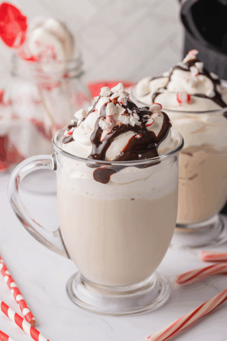 Ninja Creami Starbucks Peppermint Mocha Creamiccino topped with whipped cream, chocolate drizzle, crushed peppermint, and mini chocolate chips.