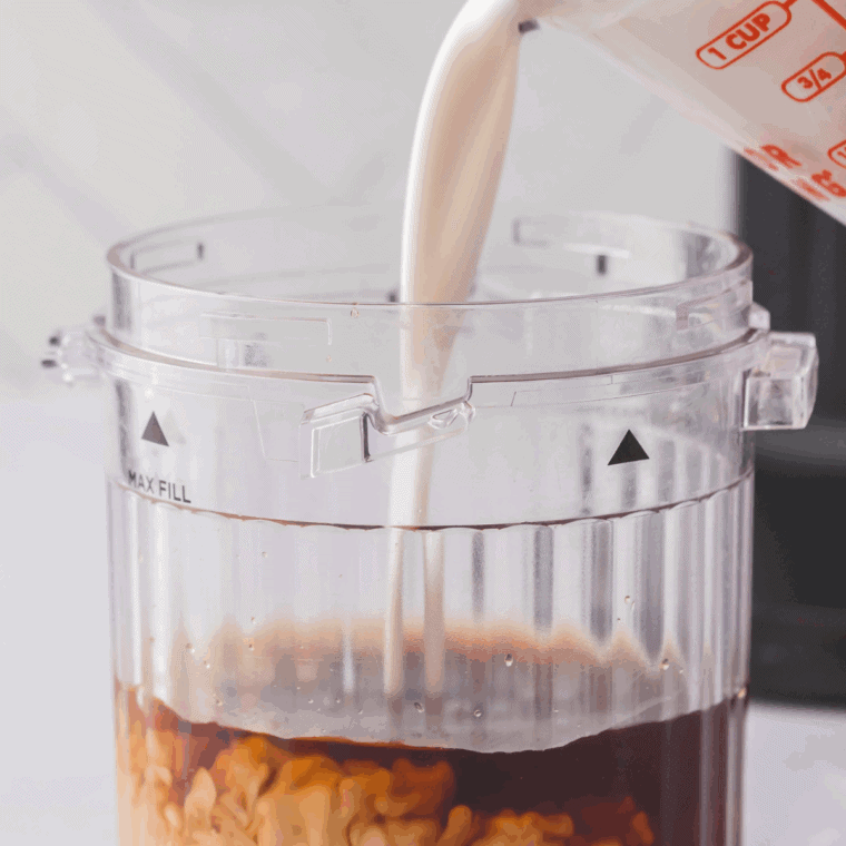 Close-up of coffee and creamer mixture in a pint container, leaving space at the top for freezing expansion.
