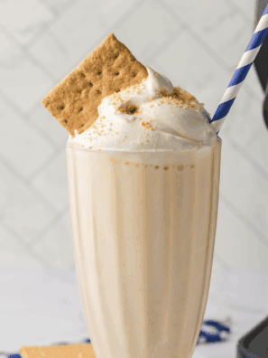 Ninja Slushi Protein Milkshake in a glass with a straw, creamy and ready to enjoy.