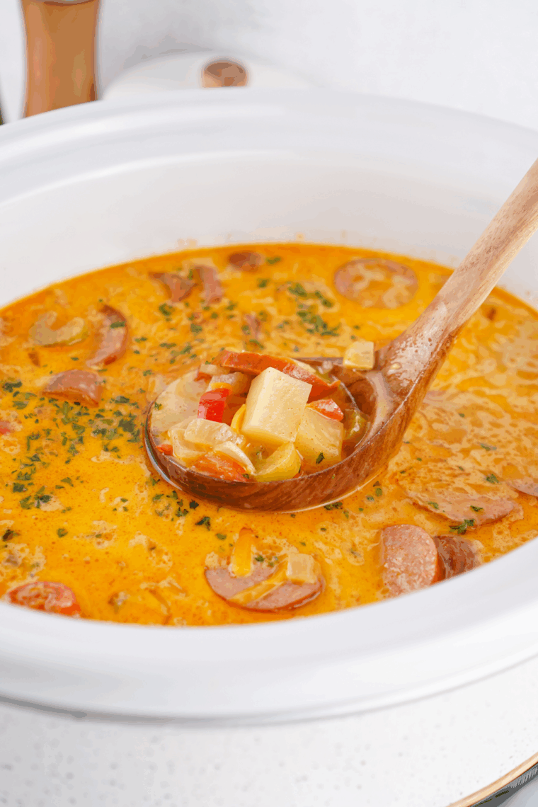 Bowl of creamy Red Lobster-style bacon potato soup garnished with crispy bacon and chopped green onions.