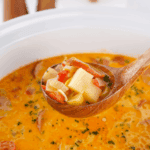 Bowl of creamy Red Lobster-style bacon potato soup topped with crispy bacon and green onions.