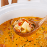Bowl of creamy Red Lobster-style bacon potato soup topped with crispy bacon and green onions.