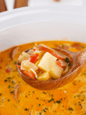 Bowl of creamy Red Lobster-style bacon potato soup topped with crispy bacon and green onions.