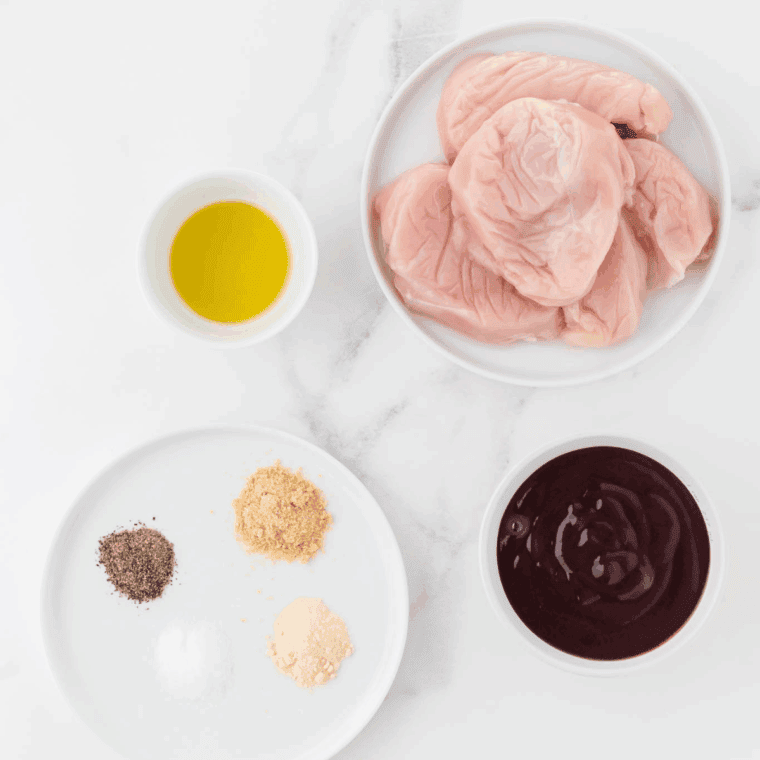 Ingredients needed for Easy Ninja Foodi Slow Cooker BBQ Chicken on kitchen table.