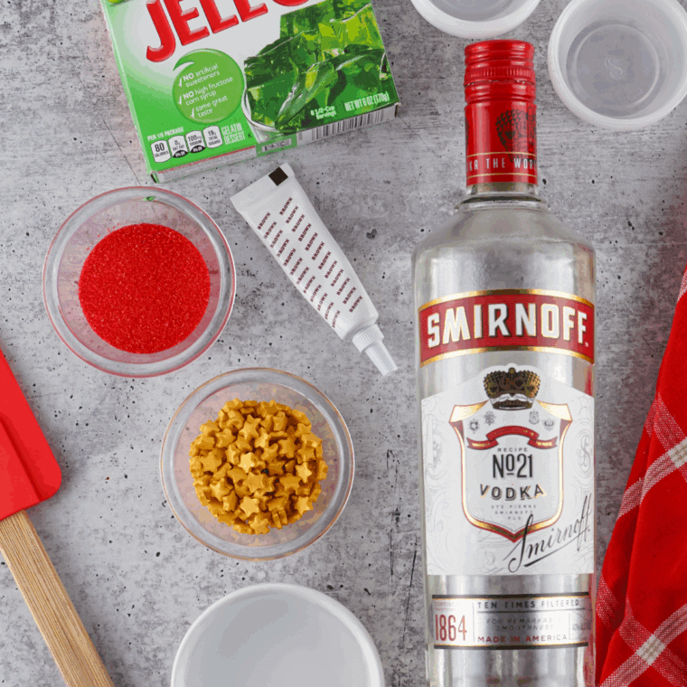 Ingredients needed for Sparkling Christmas Tree Jello Shots Recipe on kitchen table.
