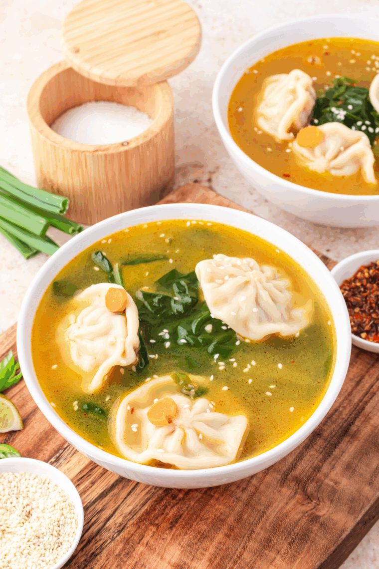 Bowl of Trader Joe’s Famous Wonton Soup with tender wontons, fresh greens, and savory broth.