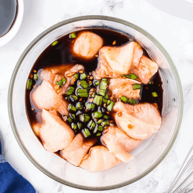 Bowl of homemade teriyaki marinade with soy sauce, brown sugar, and grated ginger