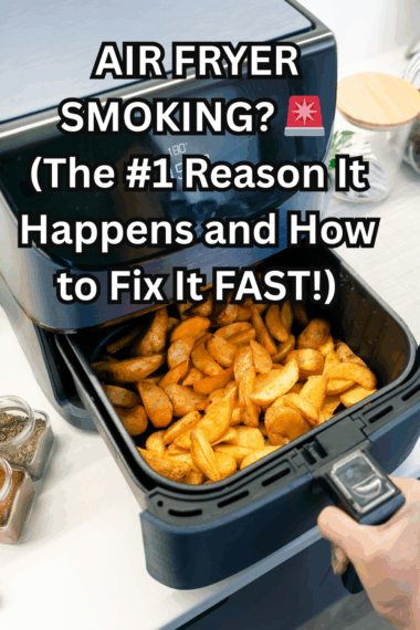 Air fryer smoking on the counter with visible smoke rising from the basket.
