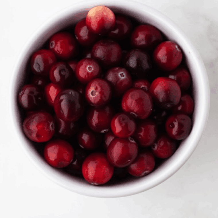 Ingredients needed for Bob Evans Cranberry Relish Recipe on kitchen table.