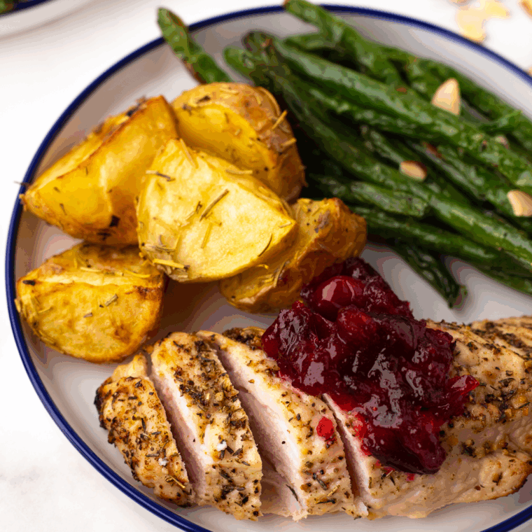 Bowl of vibrant red cranberry relish, ready to serve at holiday table