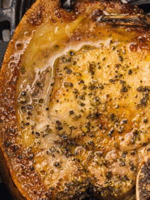 A small white bowl filled with the coarse, dark brown Copycat Kinder&rsquo;s The Blend seasoning mix, showing visible herbs, cracked pepper, and spices.