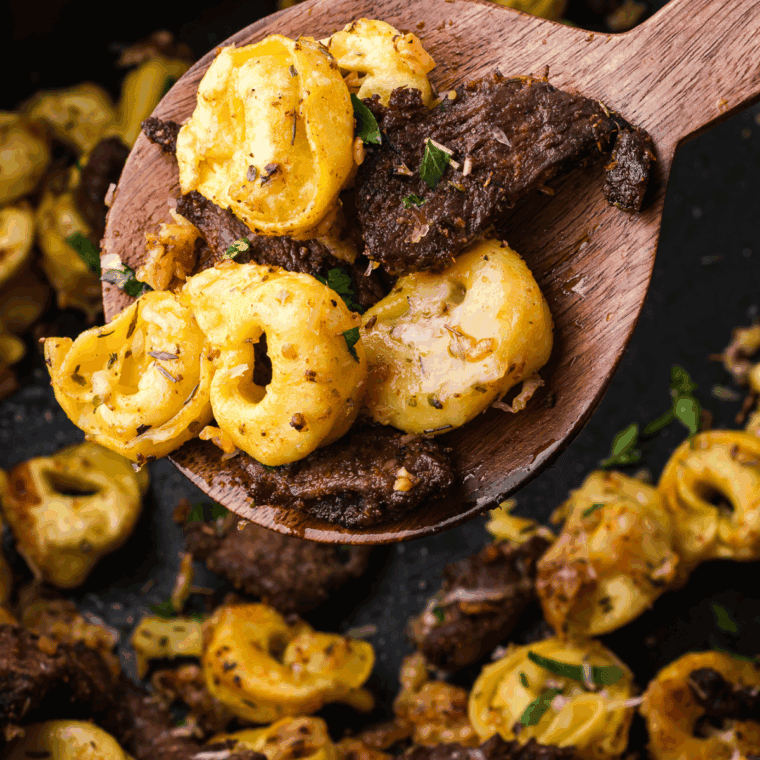 Stirring heavy cream, Dijon mustard, and Worcestershire sauce into the mushroom mixture to create a creamy sauce.