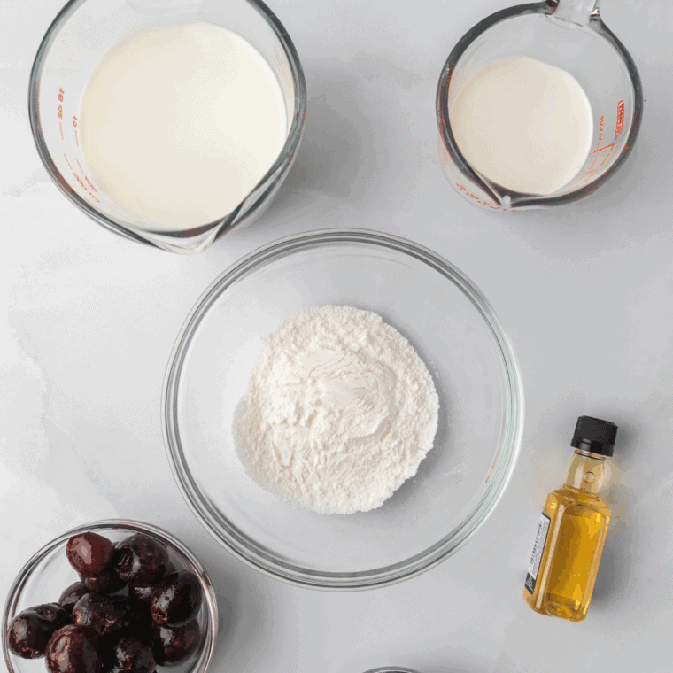 Ingredients needed for Cream Cheese Spread with Warm Cherry Sauce on kitchen table.