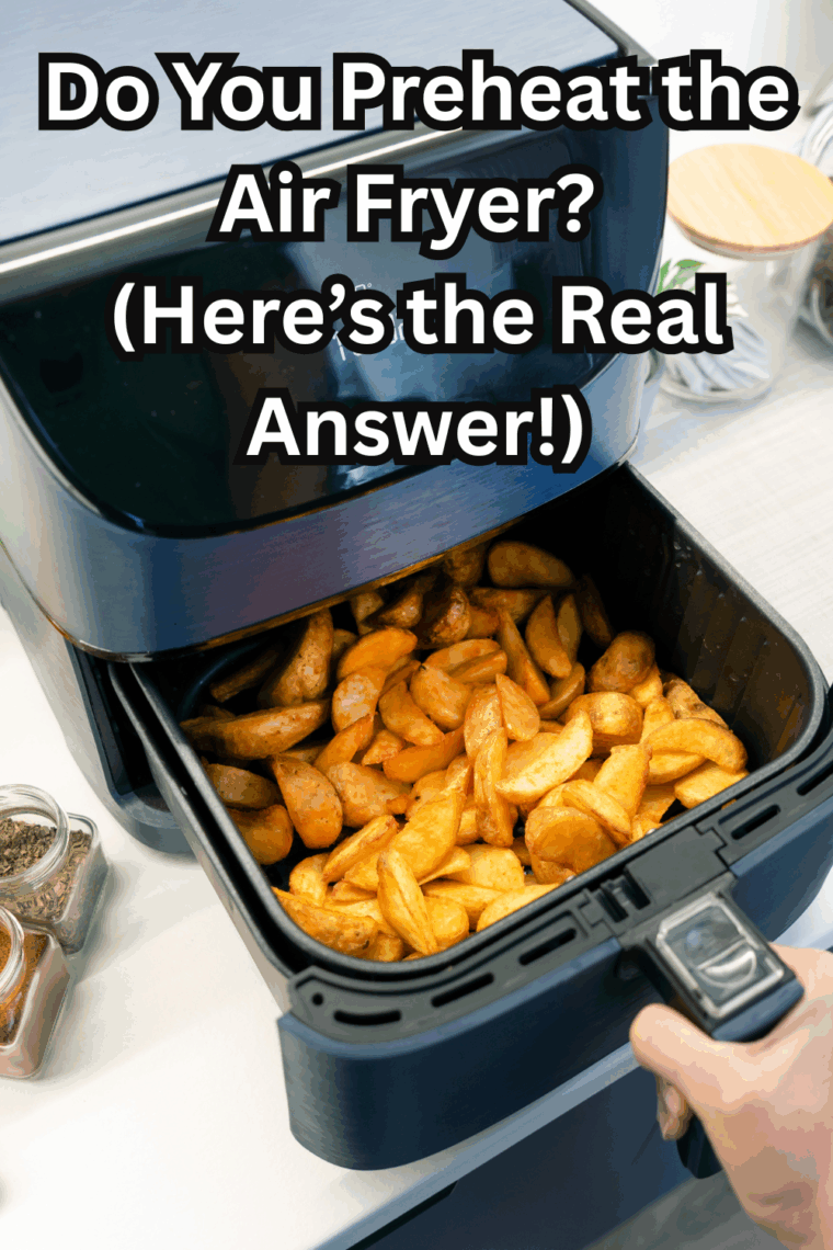 Air fryer basket being preheated before cooking food