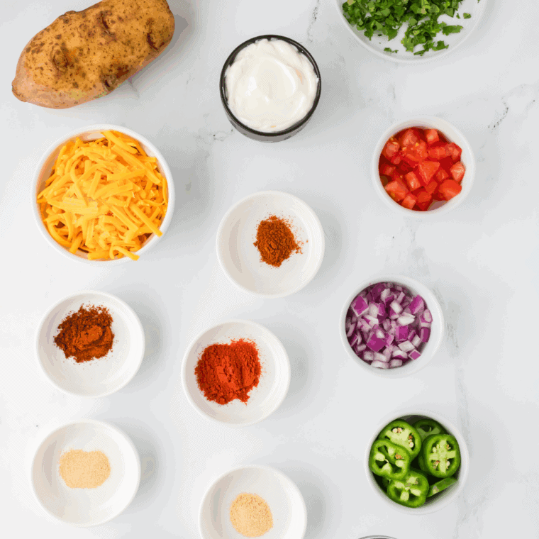 Ingredients needed for Easy 7 Layer Dip Cups on kitchen table.