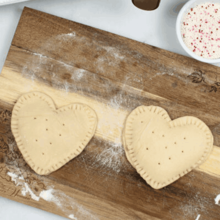 Seal the Pop-Tarts: Top crust placed over filling and edges crimped with a fork to seal in the jam.