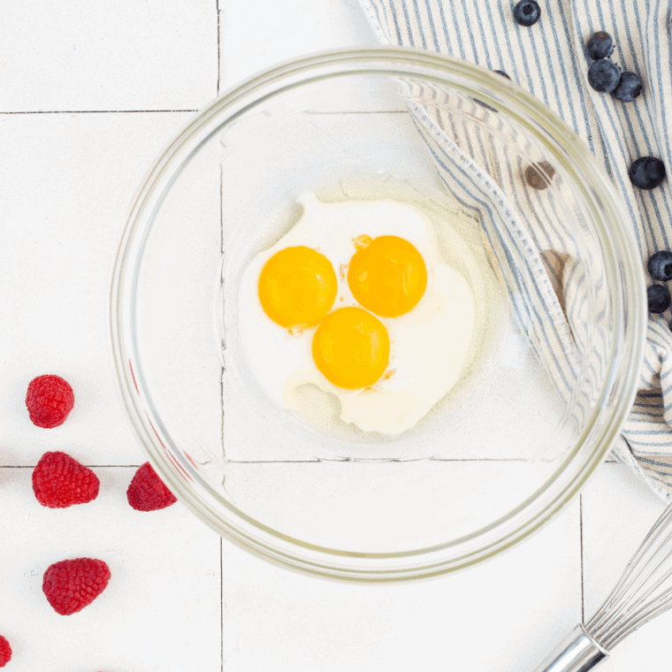 Egg yolks whisked with sugar, milk, vanilla, and flour until smooth.