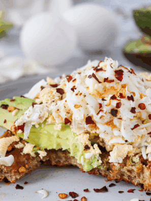 Easy Copycat First Watch Avocado Toast with fresh avocado, cherry tomatoes, and toasted bread on a plate.