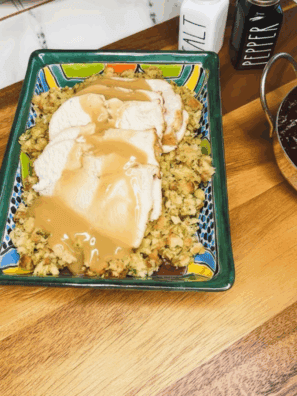 Frozen boneless turkey breast cooking in an air fryer, golden and crispy on the outside, ready to serve.