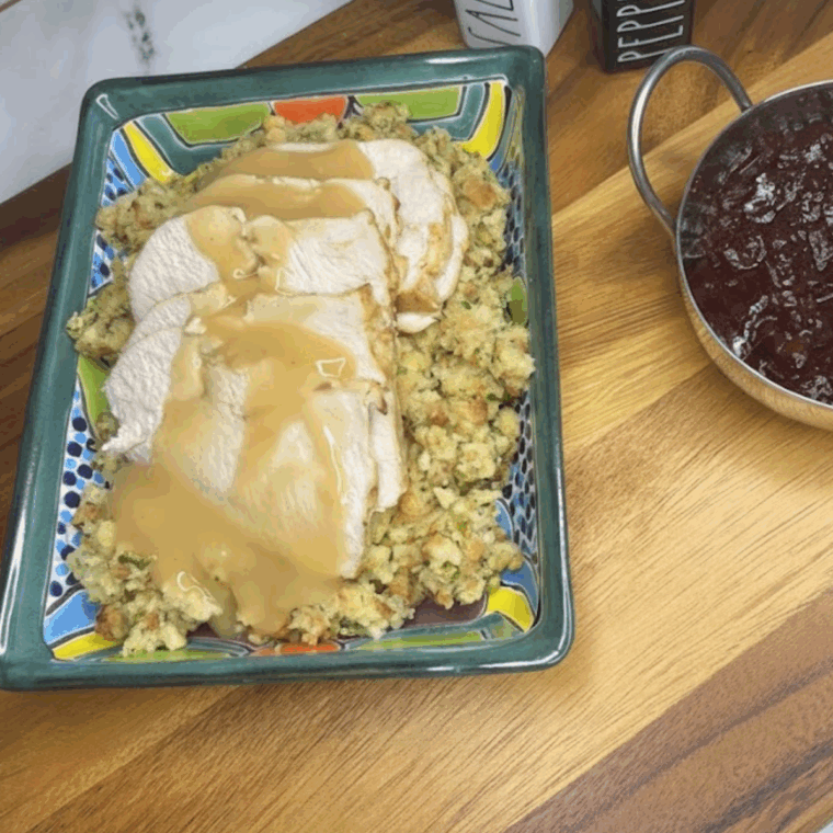 Air fryer with frozen boneless turkey breast cooking to a golden, crispy finish.