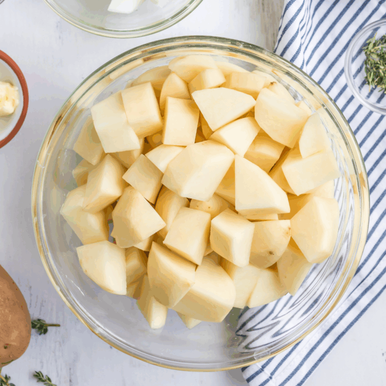 Ingredients needed for Easy Golden Corral Mashed Potatoes Recipe on kitchen table.