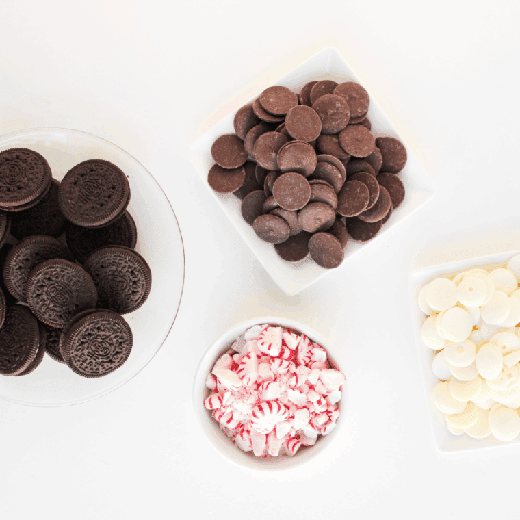 Ingredients needed for Easy Peppermint Chocolate Covered Oreos on kitchen table.