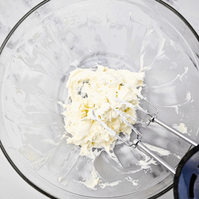 Make the cream cheese base – Cream cheese and powdered sugar beaten until fluffy with a mixer.