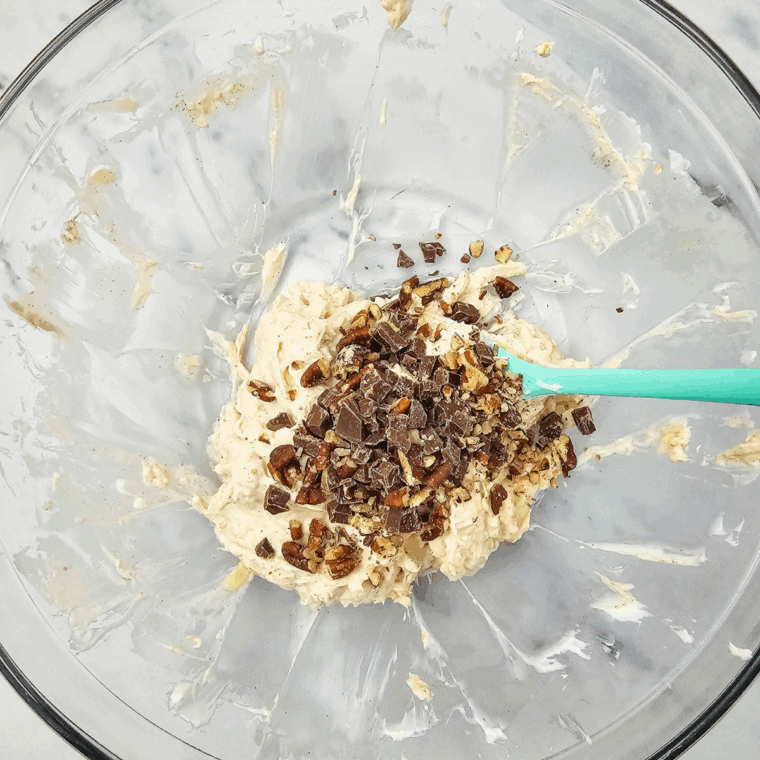 Add mix-ins – Half of the chopped pecans and chocolate folded into the mixture.