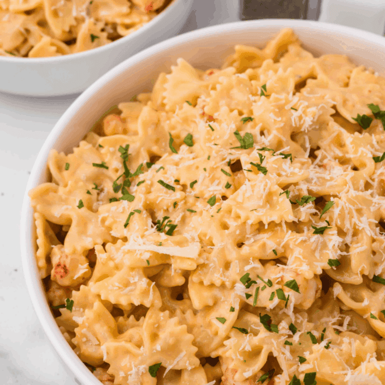 Homemade spaghetti seasoning in a small bowl with mixed dried herbs and spices.