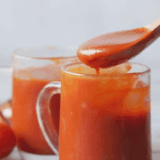 Homemade Easy Valentina Hot Sauce comes in a jar and is bright red in color and full of hot pepper flavor.