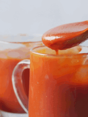 Homemade Easy Valentina Hot Sauce in a jar with vibrant red color and bold chili flavor.