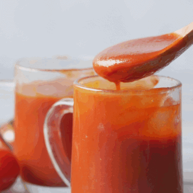 Homemade Easy Valentina Hot Sauce in a jar with vibrant red color and bold chili flavor.