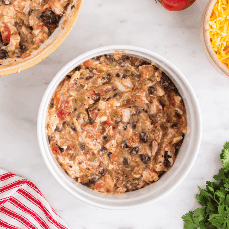 Chicken casserole mixture spooned over tortilla chips.