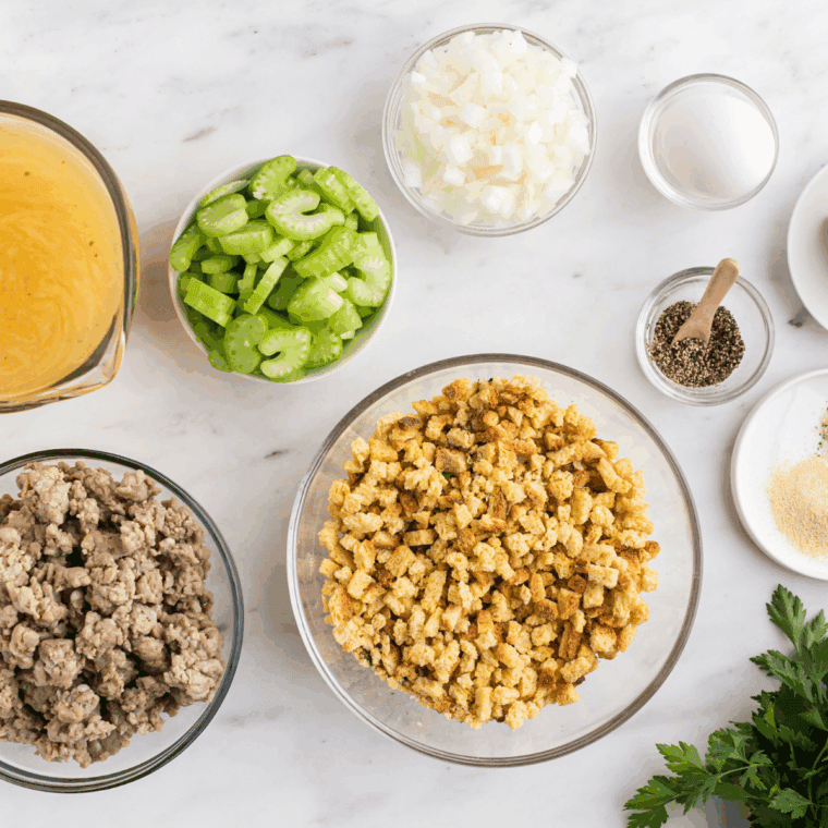 Ingredients needed for Ina Garten's Cornbread Stuffing on kitchen table.