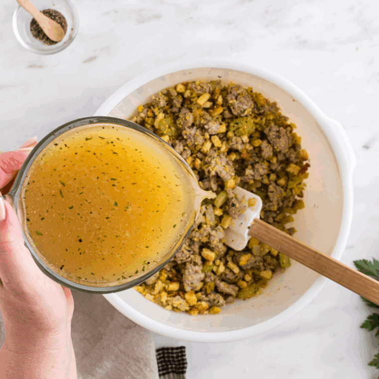 Chicken stock and beaten eggs poured over cornbread mixture