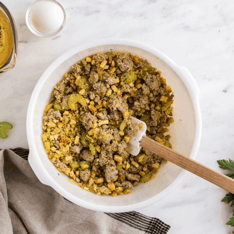 Cornbread stuffing baking in a casserole dish until golden
