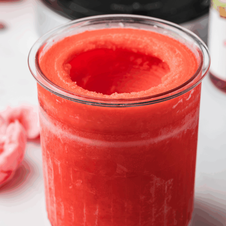 Pink and blue cotton candy Italian ice served in a bowl, made with a Ninja Creami.