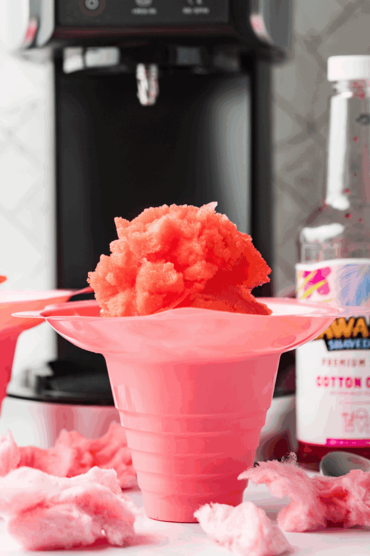 Bowl of pink and blue cotton candy Italian ice made in a Ninja Creami.