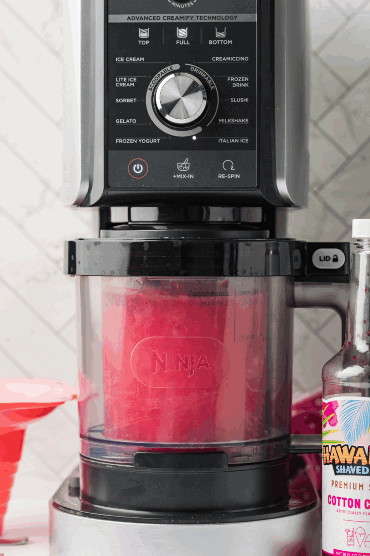 Bowl of pink and blue cotton candy Italian ice made with a Ninja Creami.