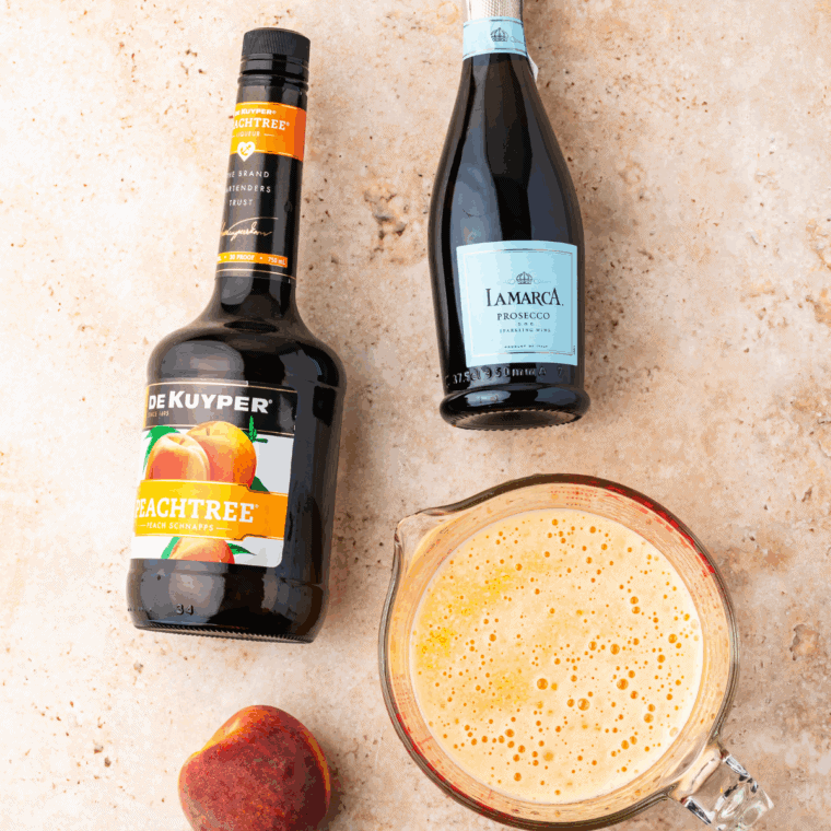 Ingredients needed for Ninja Slushi Frozen Peach Bellini on kitchen table.