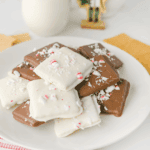 Stacked Easy Peppermint Crunch Graham Crackers dipped in white chocolate and generously covered with crushed red and white candy canes.