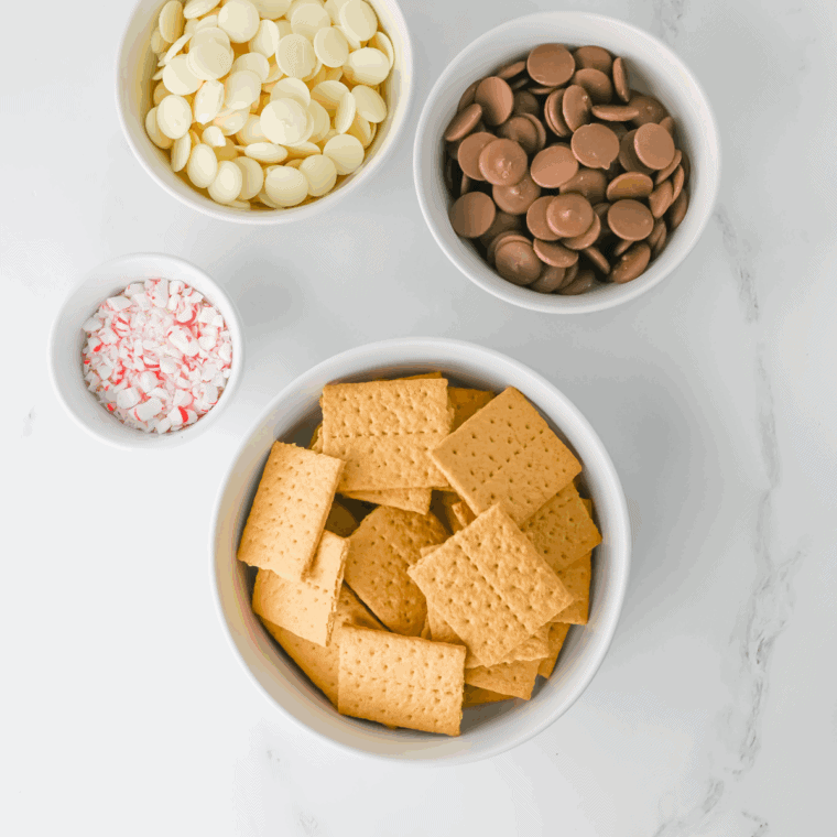 Ingredients needed for Easy Peppermint Crunch Graham Crackers on kitchen table.