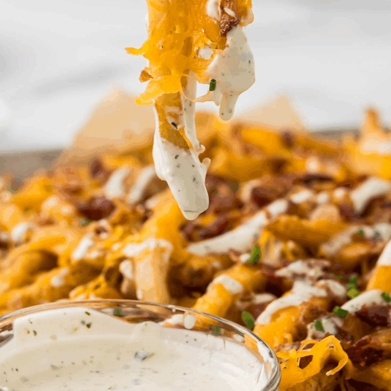 Creamy Ruth's Crispy Ranch Dressing served in a small bowl with fresh herbs